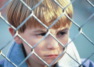 child_behind_fence Watford Council - Parents can watch their own children from a perimeter fence